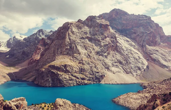 Beautiful serene lake in  Fanns mountains (branch of Pamir) in Tajikistan.