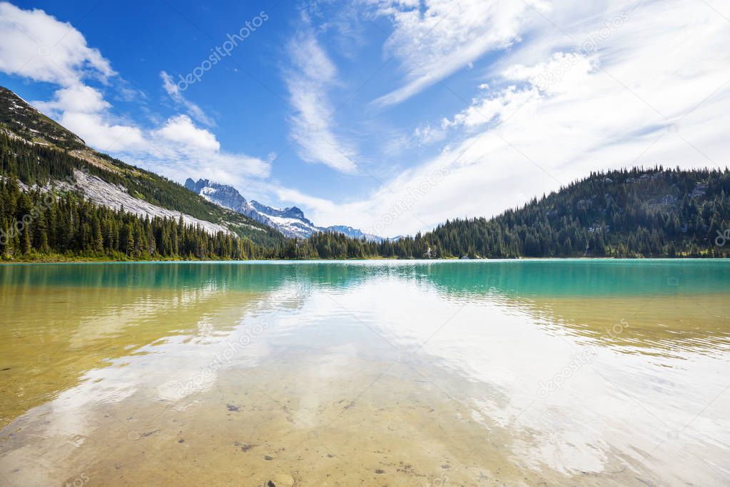 Serenity lake in the mountains in summer season. Beautiful natural landscapes.