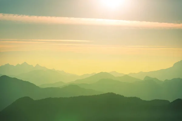 Beautiful natural background. Mountain silhouette at the sunset.