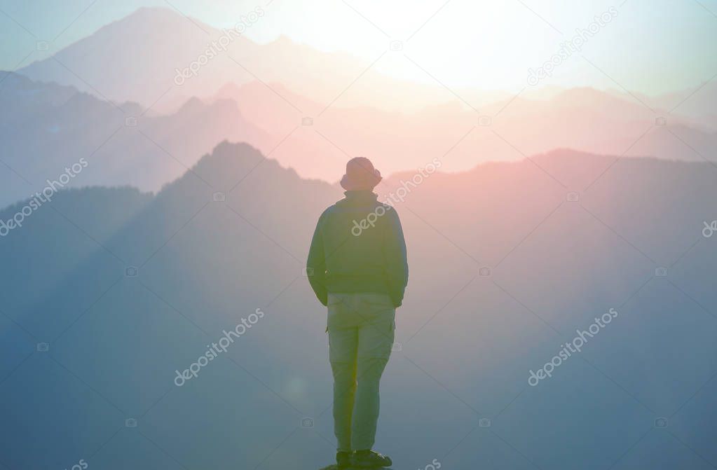 Hiking scene in beautiful summer mountains at sunset