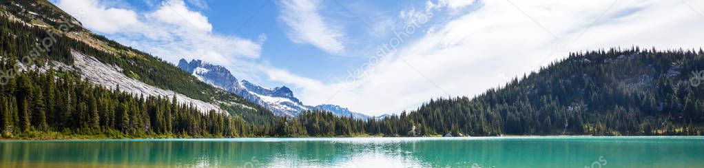 Serenity lake in the mountains in summer season. Beautiful natural landscapes.