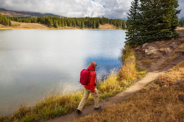 Hike in the autumn mountains. Fall season theme.