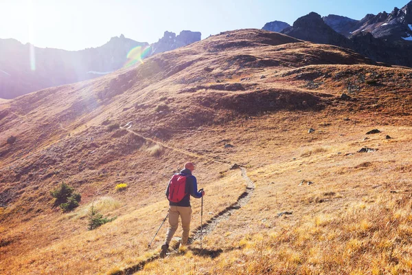 Hike in the autumn mountains. Fall season theme.