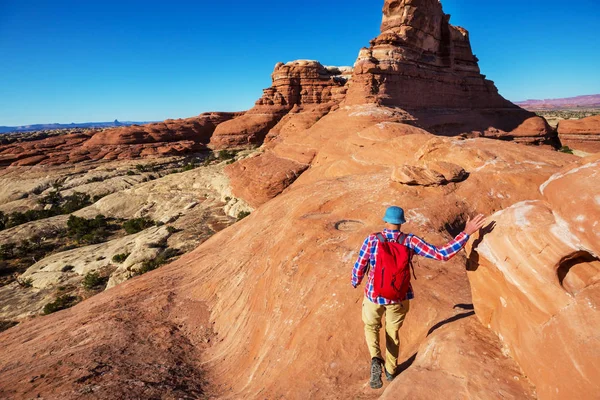 Hike in the Utah mountains. Hiking in unusual natural landscapes. Fantastic forms sandstone formations.