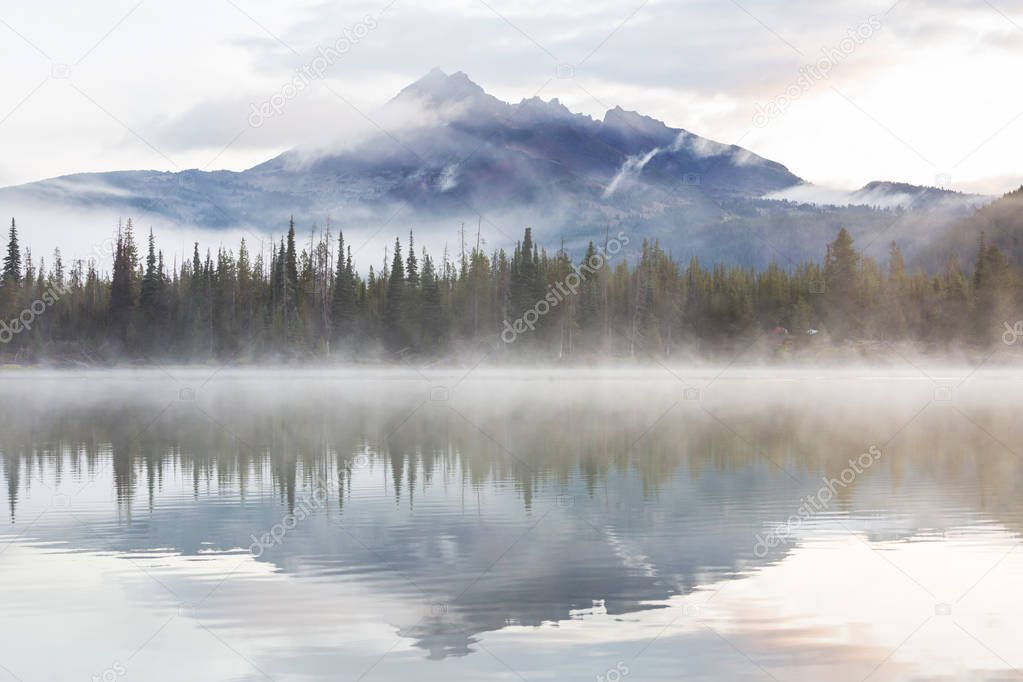 Serene beautiful lake in morning mountains, Oregon, USA.