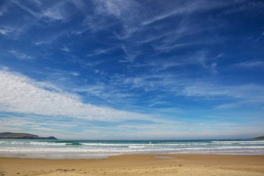 Ocean Beach, Yeni Zelanda 'da güzel bir gün batımı. İlham verici doğal ve seyahat geçmişi