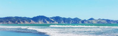 Ocean Beach, Yeni Zelanda 'da güzel bir gün batımı. İlham verici doğal ve seyahat geçmişi