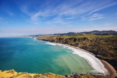 Ocean Beach, Yeni Zelanda 'da güzel bir gün batımı. İlham verici doğal ve seyahat geçmişi