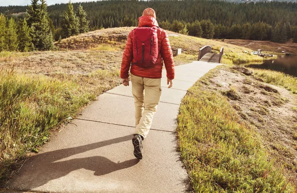 Hike in the autumn mountains. Fall season theme.