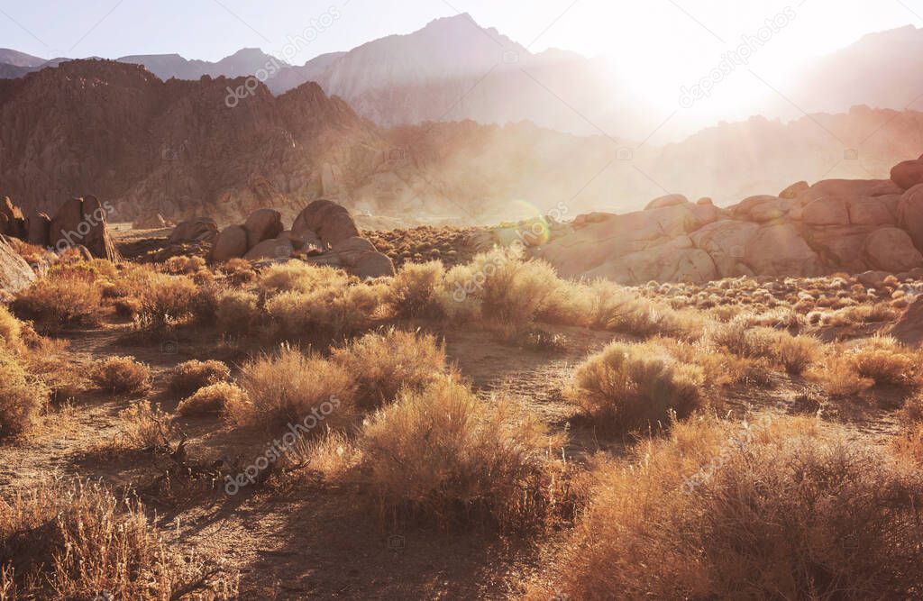 Hiker in unusual stone formations in Alabama hills, California, USA