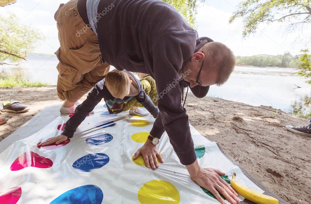 Kids playing twister game outdoors