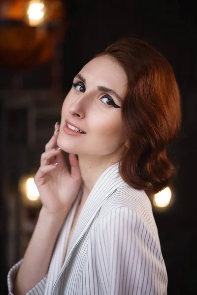 Pretty redhead thin young woman in white unbuttoned pant suit — Stock Photo, Image