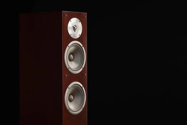 Red wooden high gloss music speakers tower isolated on black background
