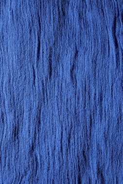 Blue fabric mesh. Rumpled cloth background.