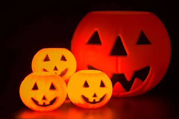 Halloween night scene with Jack O Lanterns, tombstones, skulls and gargoyles
