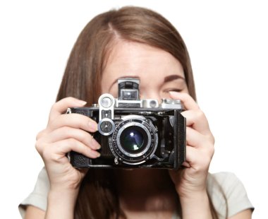 Mutlu genç kız ve retro kamera. Hobi