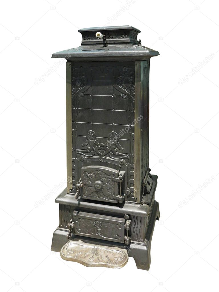 Old vintage burning heater cast iron stove isolated over white background
