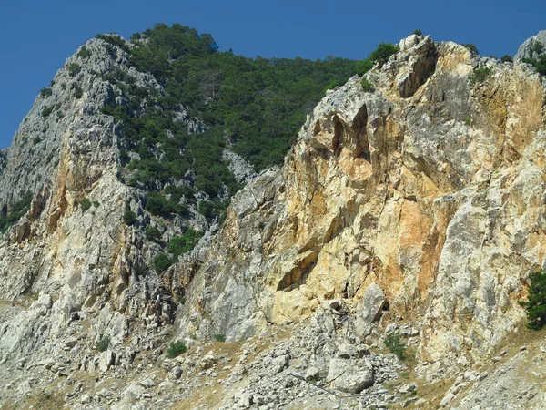 High rock mountains over blue sky background — Stock Photo, Image