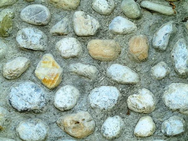 Textura de fondo de la antigua pared de piedra gris redonda —  Fotos de Stock