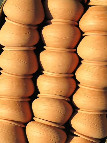 Beautiful brown handmade clay pots sold at fair shop — Stock Photo, Image