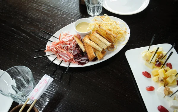 Beautiful served food on plates in restaurant