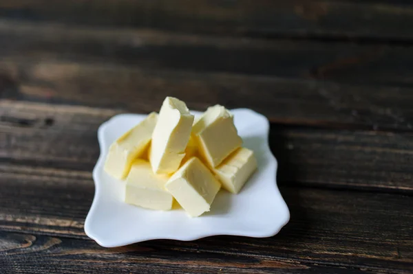 Kawałek masła na biurku — Zdjęcie stockowe