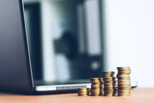 Stacked Columns Money Coins Laptop Computer Defocussed Background Finance Economy — Stock Photo, Image