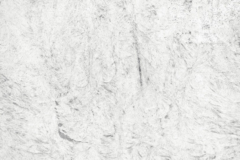 Bright white grunge distressed textured surface as background 