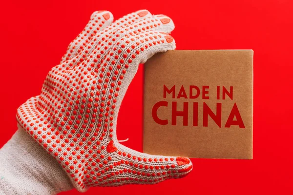 Made China Worker Protective Gloves Holding Cardboard Product Package Red — Stock Photo, Image