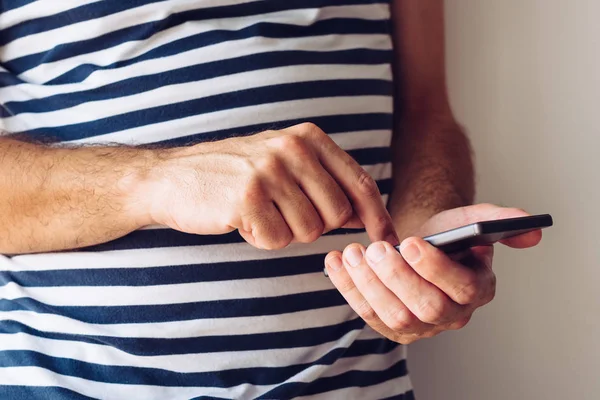 Man Striped Nautical Sailor Shirt Using Mobile Phone Close Hands — Stock Photo, Image