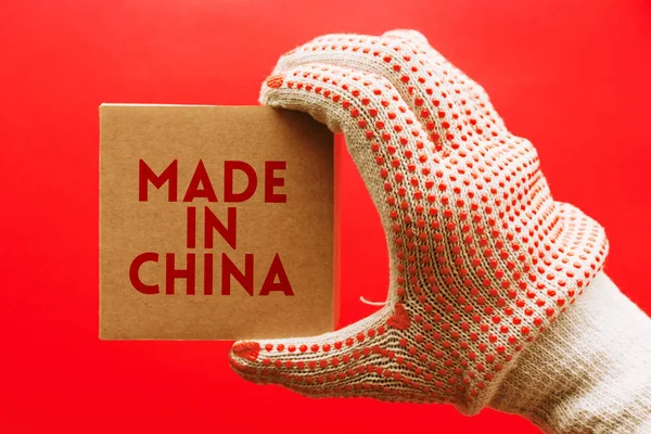 Made China Worker Protective Gloves Holding Cardboard Product Package Red — Stock Photo, Image