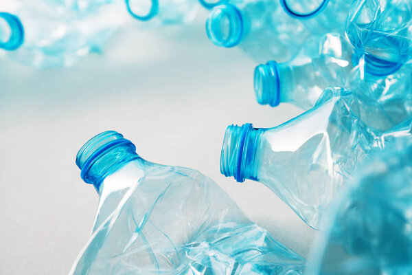 Crushed plastic bottles heap ready for recycling