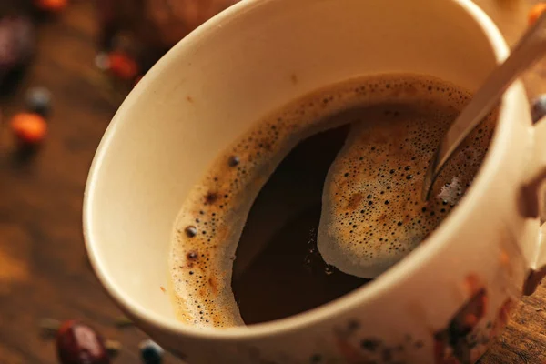 Autumn morning coffee is on the table, close up selective focus