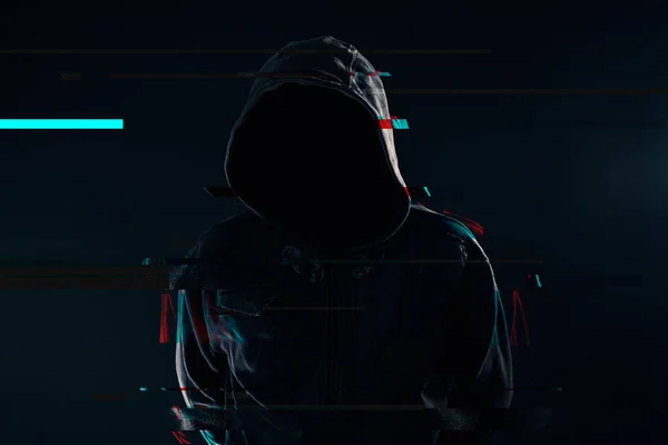 Hooded computer hacker with obscured face, glitch effect