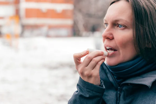 Woman Applying Lip Balm Out Street Cold Winter Day — Stock Photo, Image