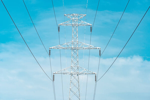 Frozen electricity pylon, power and energy industrial concept