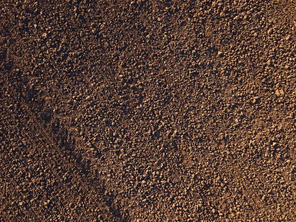 Aerial view of arable land soil ground from drone point of view