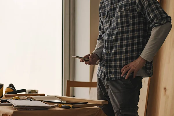 Carpenter Using Smartphone Texting Woodwork Workshop — Stock Photo, Image