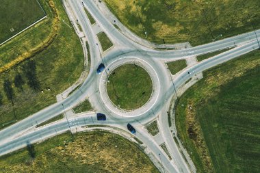 Aerial view of traffic circle roundabout road junction, top view clipart