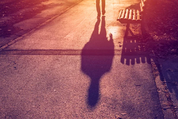 Shadow of male pedestrian on the pavement — Stock Photo, Image