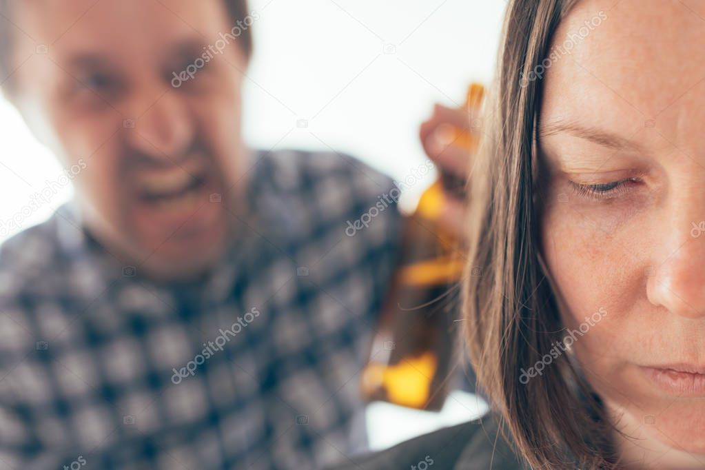 Drunk man drinking beer and arguing with his wife