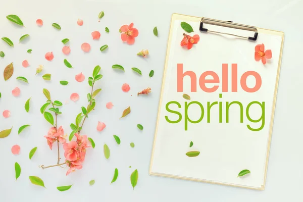 Hello Spring message on clipboard note paper — Stock Photo, Image