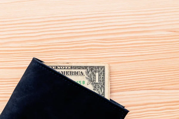 One dollar bill in leather wallet — Stock Photo, Image