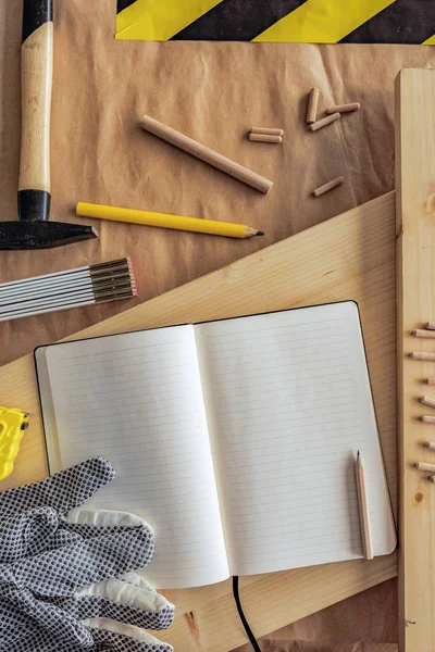 Open note book with blank pages in carpentry workshop — Stock Photo, Image