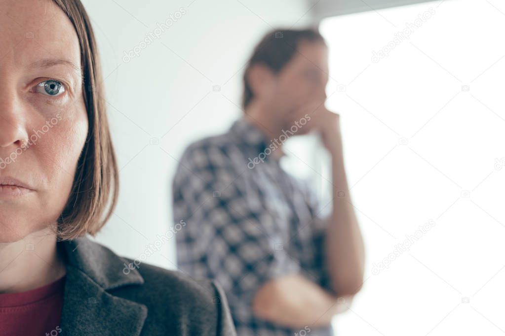 Husband and wife arguing, man yelling at woman