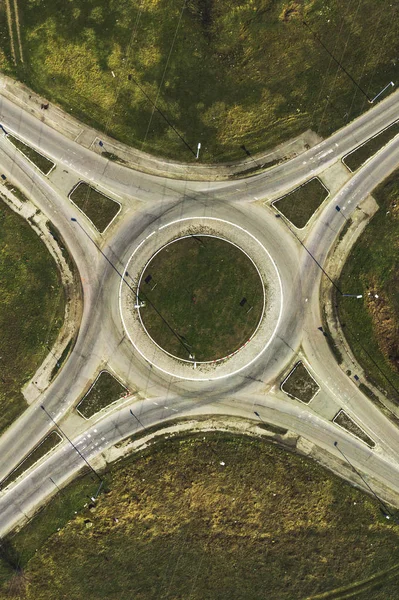 Aerial view of traffic circle roundabout road junction, top view