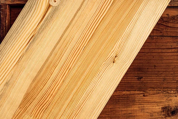 Wooden plank boards background, new one above old
