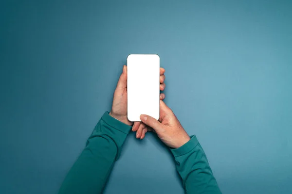 Woman holding smartphone with mock up screen — Stock Photo, Image