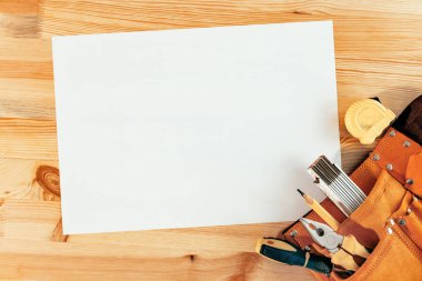 Empty paper as mock up copy space on woodwork desk clipart