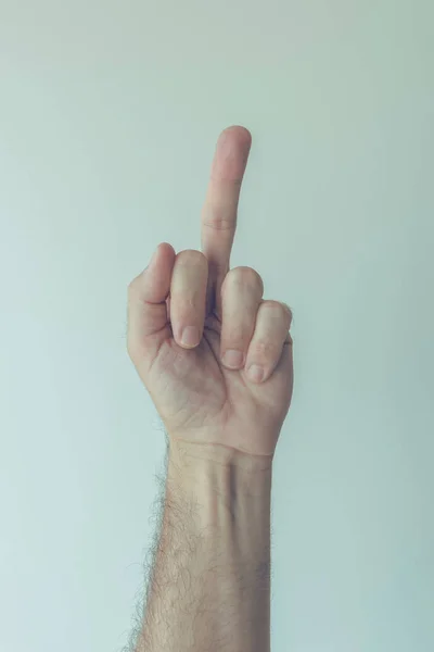 Mão masculina gesticulando dedo médio — Fotografia de Stock